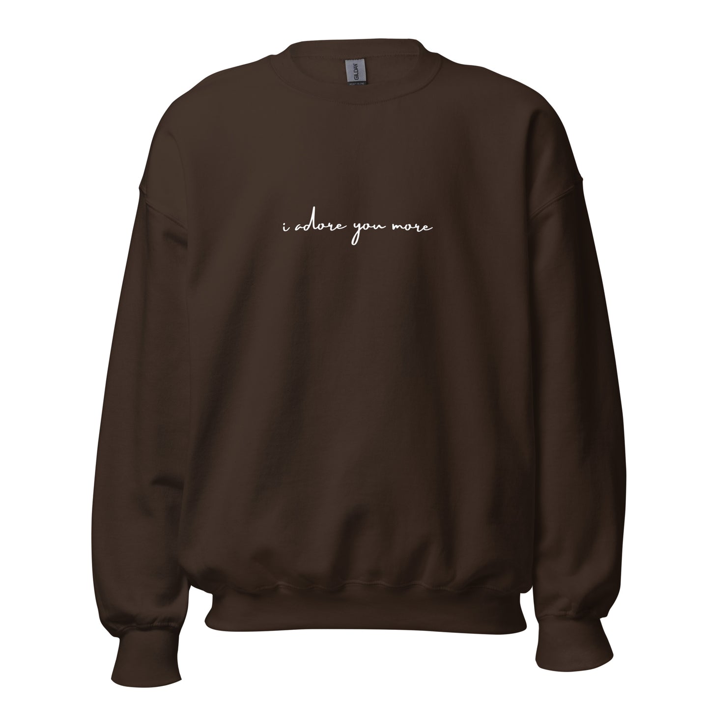 Dark chocolate crewneck sweatshirt with white text reading “i adore you more,” centered on the chest