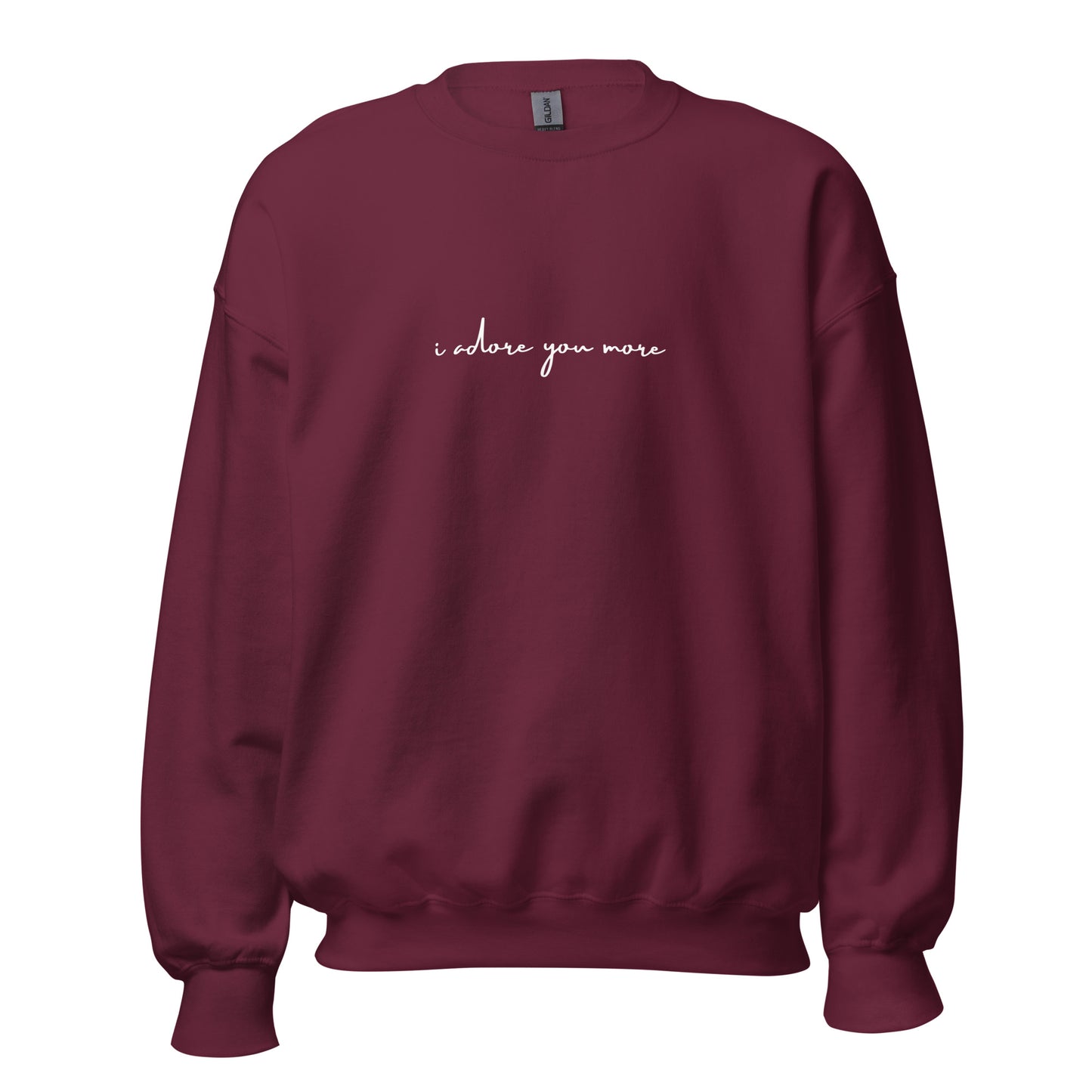 Maroon crewneck sweatshirt with white text reading “i adore you more,” centered on the chest